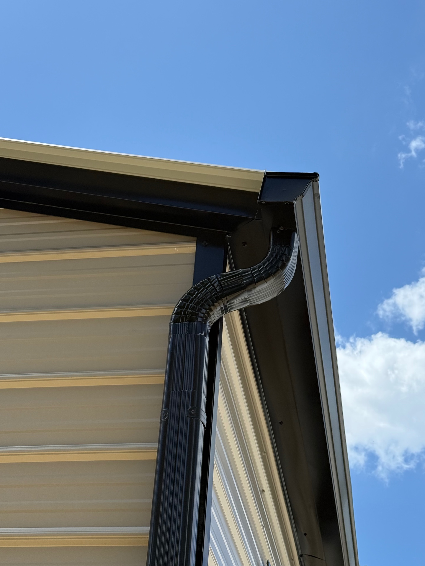 Detail of finished gutter and downspout on a Taylor Crafted Homes specialty structure